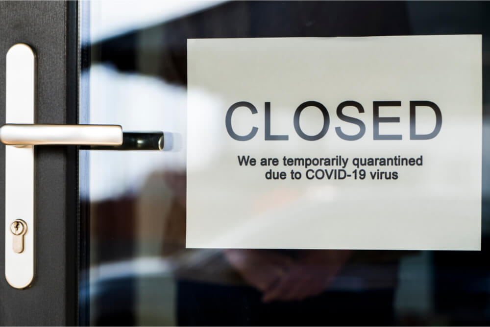 Business with a closed sign on the door.