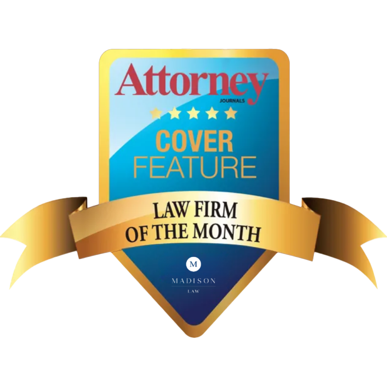 Attorney Journal "Law Firm of the Month" badge awarded to Madison Law, with a gold ribbon and blue cover feature shield.
