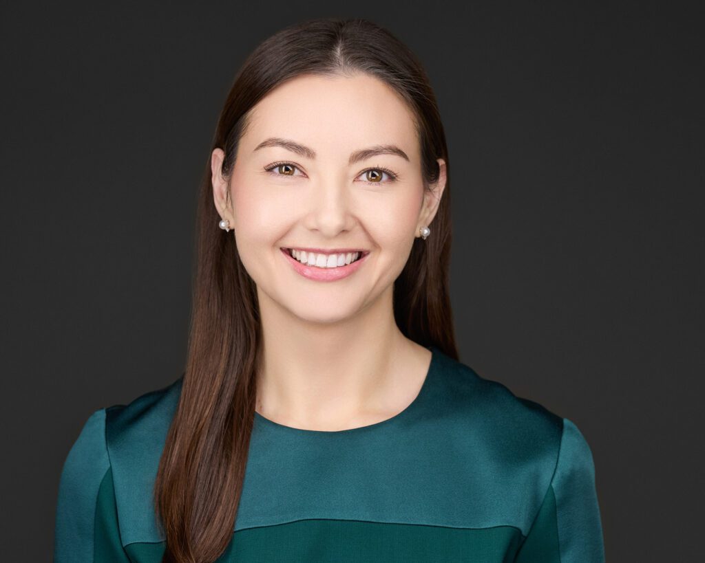 Professional headshot of Susanna F. Wiseman, Esq., partner at Madison Law, in a teal blouse, smiling confidently.