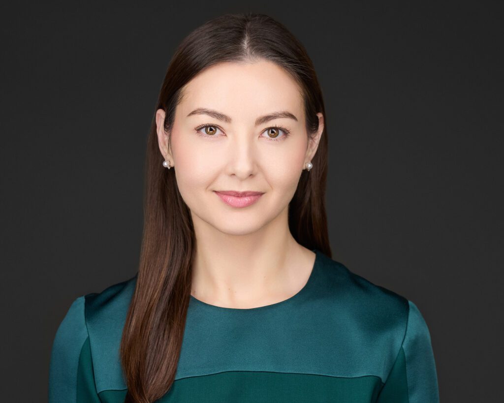 Professional headshot of Susanna F. Wiseman, Esq., partner at Madison Law, in a teal blouse, smiling confidently.